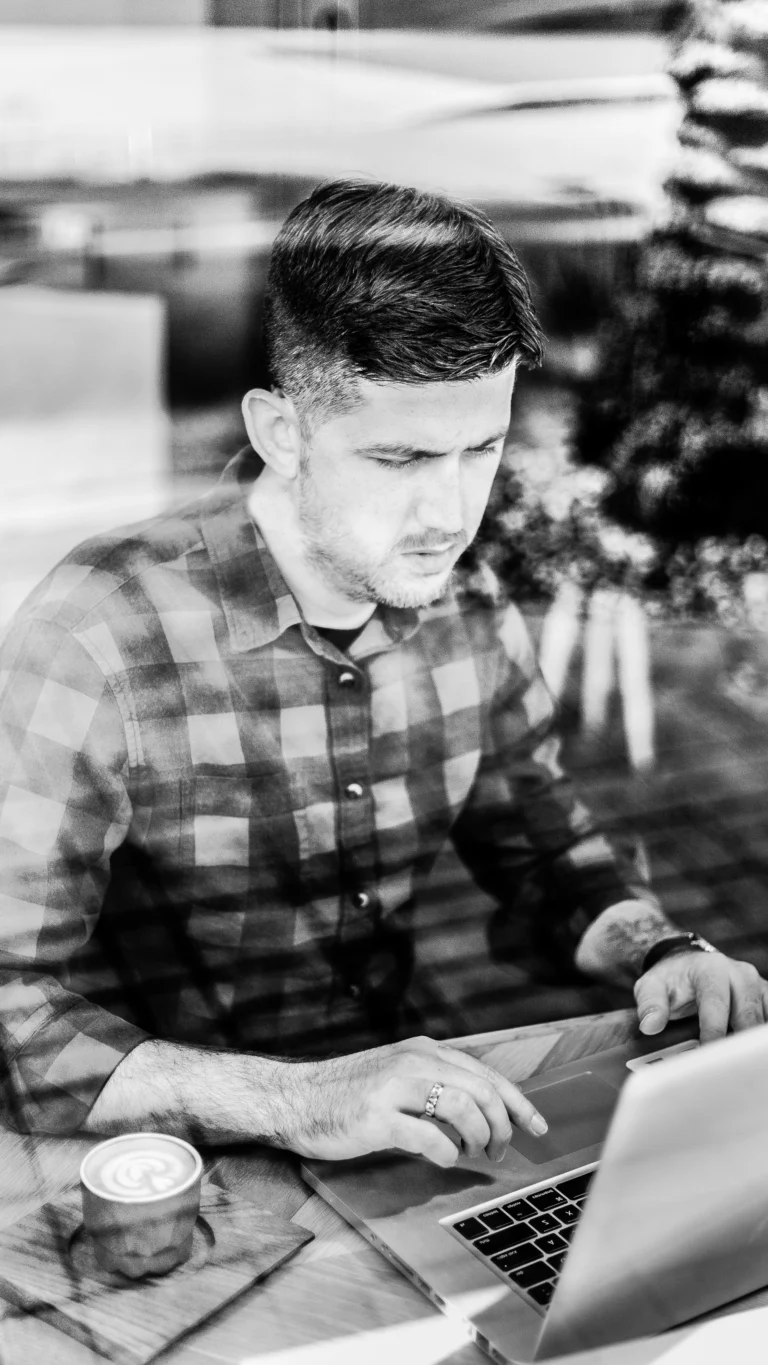 Jordan, founder and lead strategist of Site Social SEO, working at his computer for law firm client